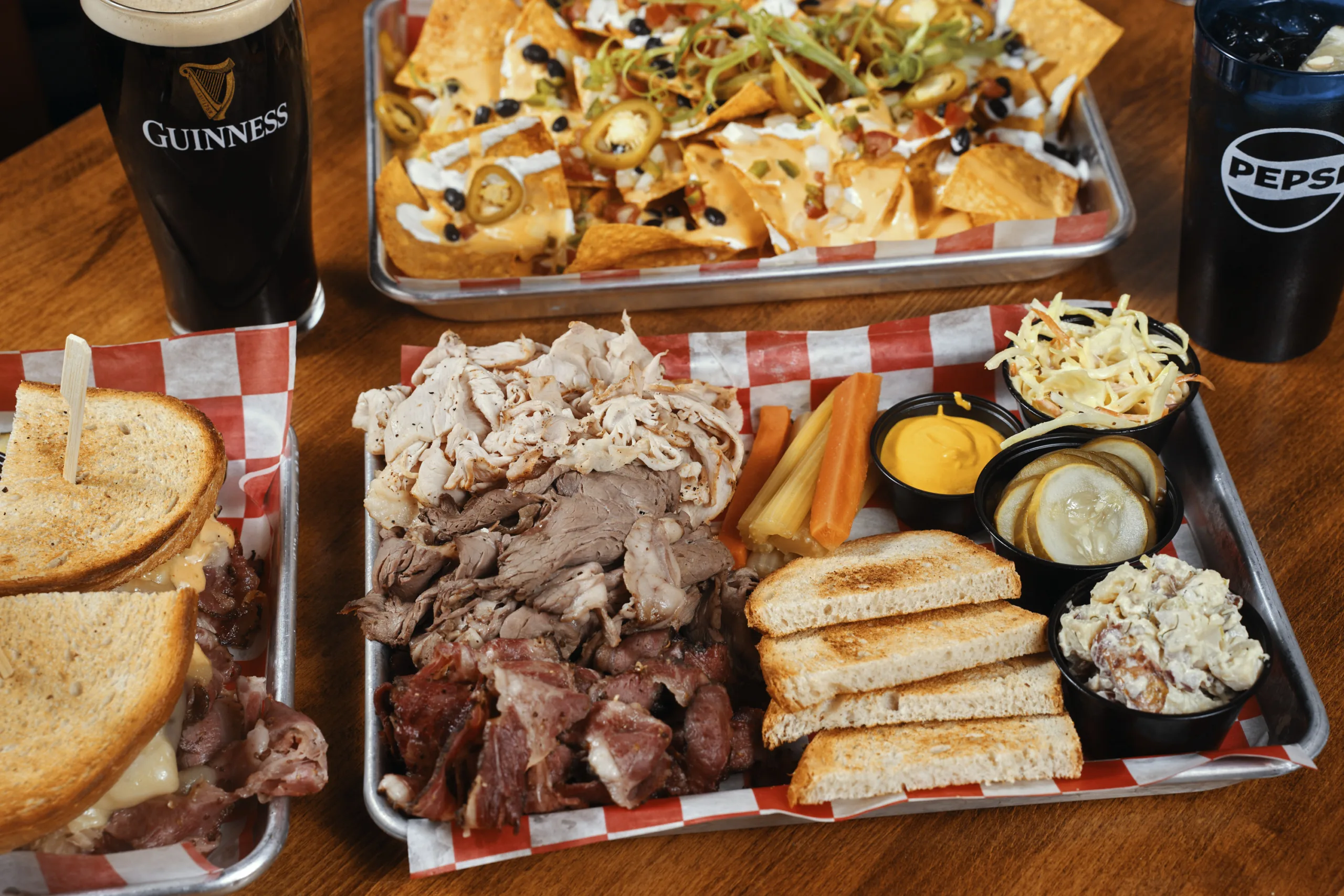 A spread of sandwiches, nachos and pub favorites